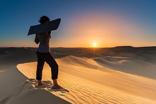 Sand boarding in the desert
